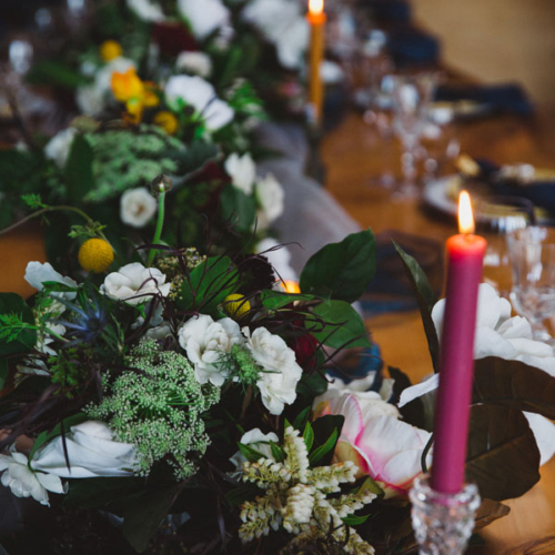 row of floral wedding centerpieces, by Vancouver Island florist Petal and Kettle in Parksville, B.C.
