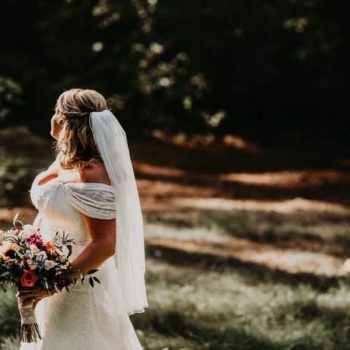 bride holding wedding bouquet on Vancouver Island, bridal flowers by Petal and Kettle