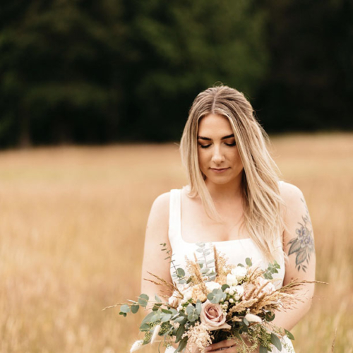 bride on Vancouver Island carrying wedding bouquet by Parksville's Petal and Kettle