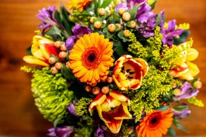 cheerful yellow and purple flower vase arrangement from Qualicum Beach Parksville Nanaimo floral delivery service and florist Petal and Kettle