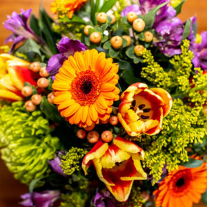 cheerful yellow and purple flower vase arrangement from Qualicum Beach Parksville Nanaimo floral delivery service and florist Petal and Kettle