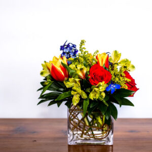 cheerful yellow and purple flower vase arrangement from Qualicum Beach Parksville Bowser floral delivery service and florist Petal and Kettle