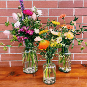 Three vases filled with flowers for Mother's Day by Parksville florist Petal and Kettle