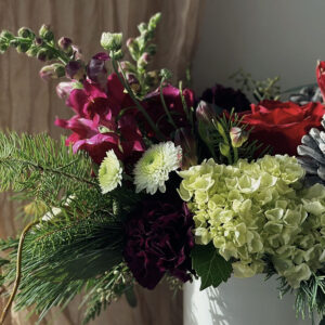 Holiday Vase arrangement in festive hues, made by Parksville florist Petal and Kettle